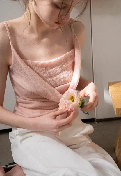 Silk-like tank top with thin straps and draped neckline