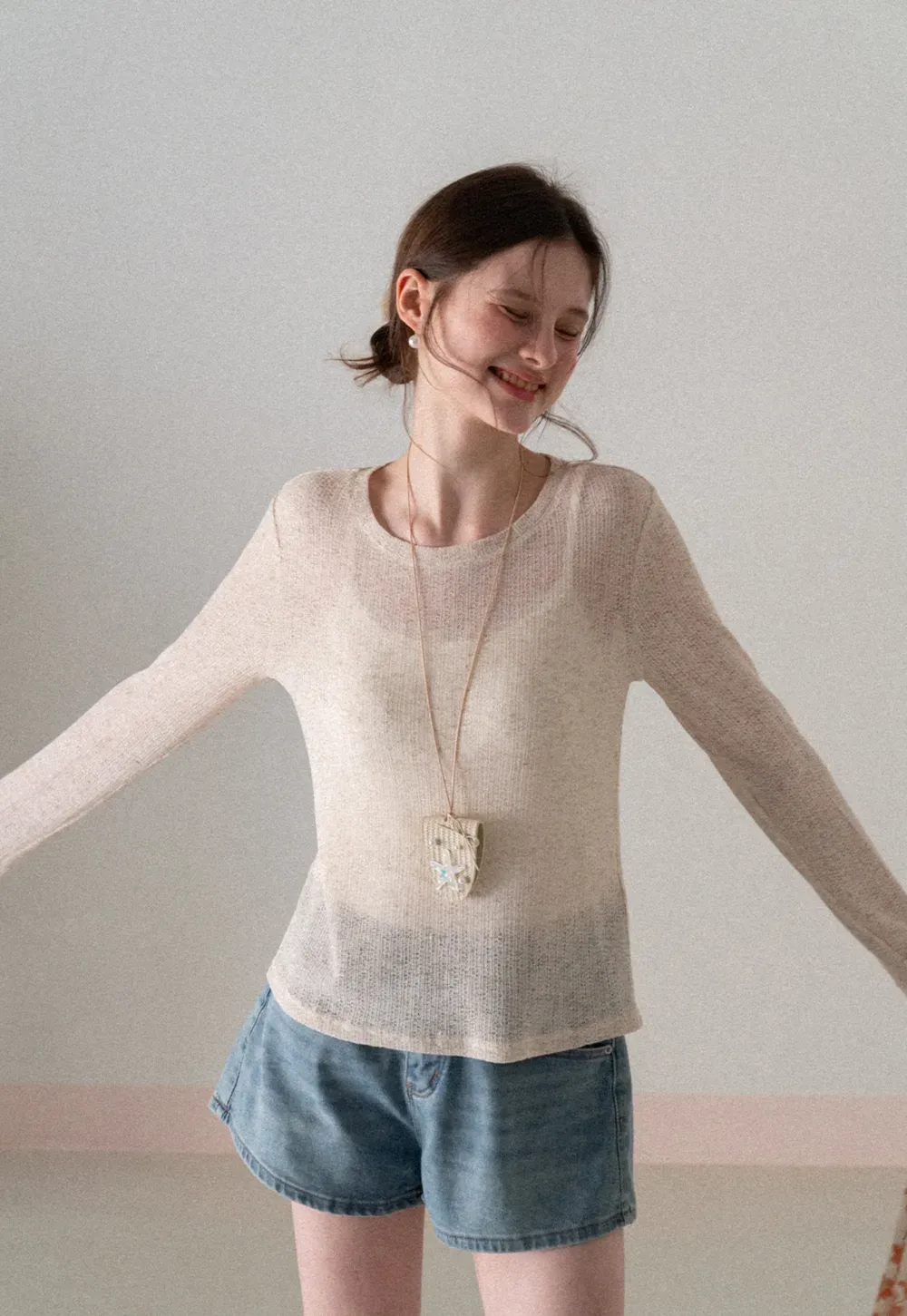 Long sleeve sheer knit top with round neckline