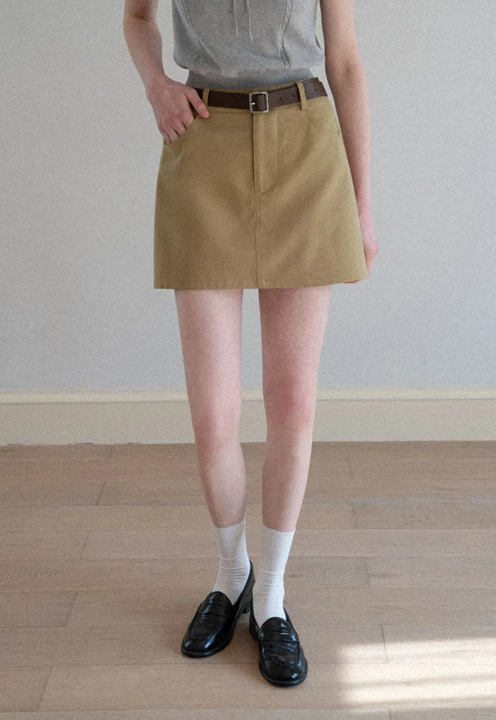 A-line mini skirt with front pockets and belt loops