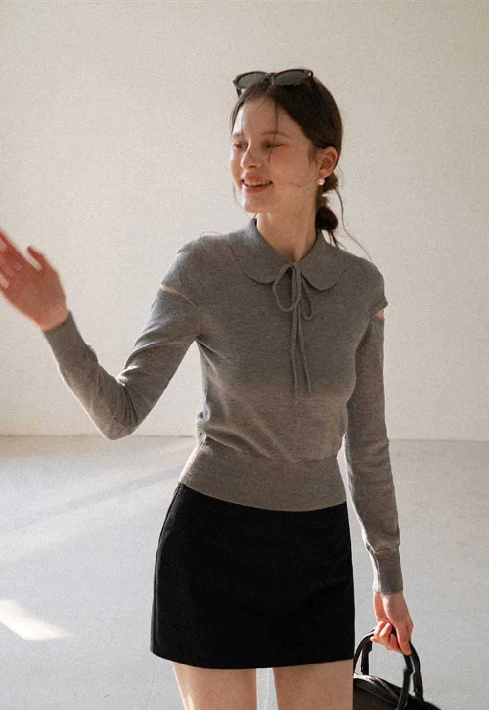 Elegant Knit Sweater with Bow Detail and Cutout Sleeves