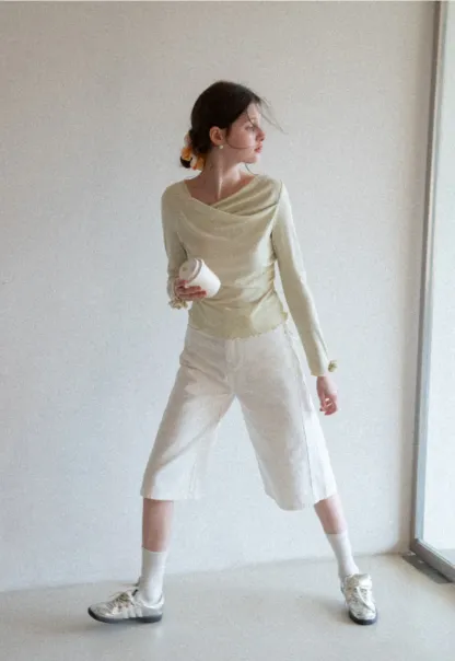 Long sleeve top with ruffled hem and cuffs