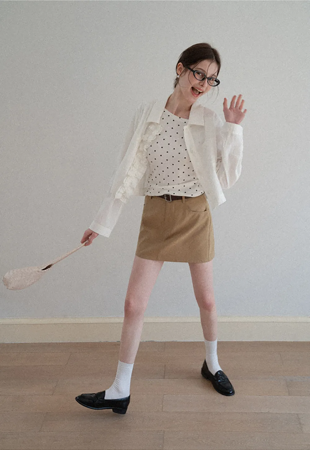 Short jacket with ruffled front placket and collar