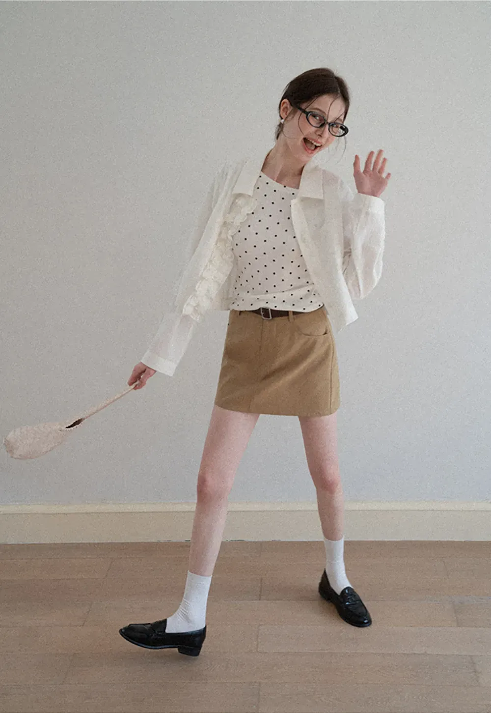 Short jacket with ruffled front placket and collar