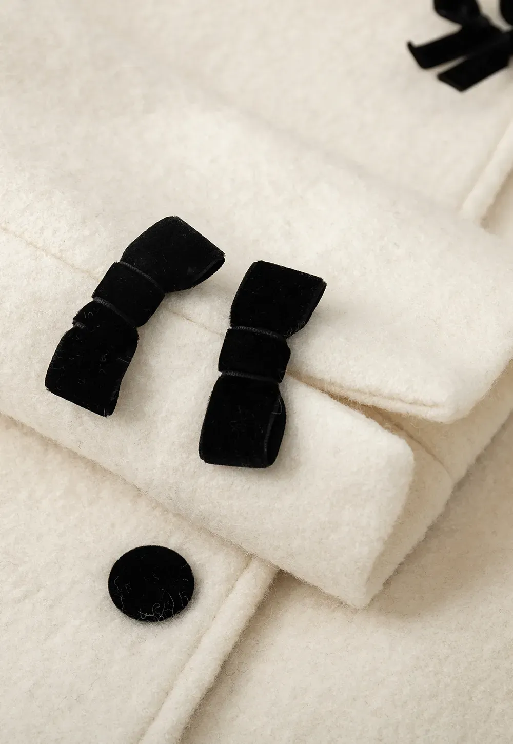 Elegant Wool Coat with Bow Detail and Contrasting Collar