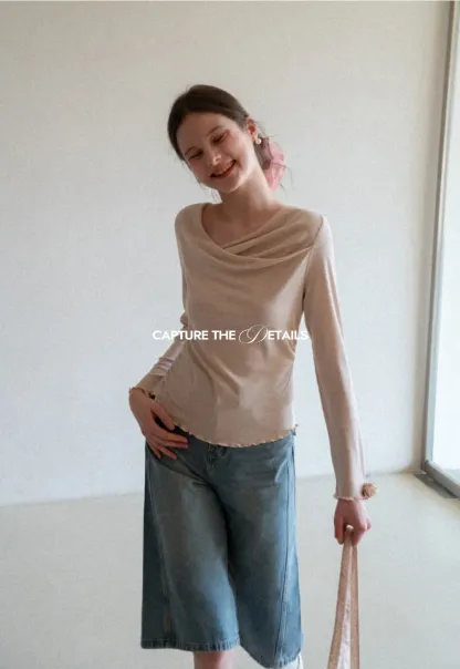 Long sleeve top with ruffled hem and cuffs