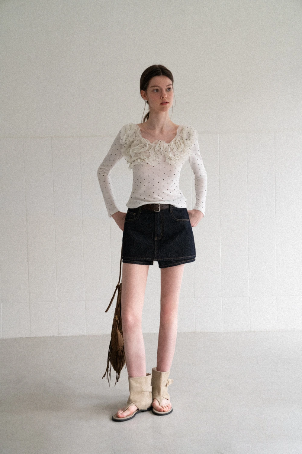 Polka dot long sleeve top with ruffled neckline