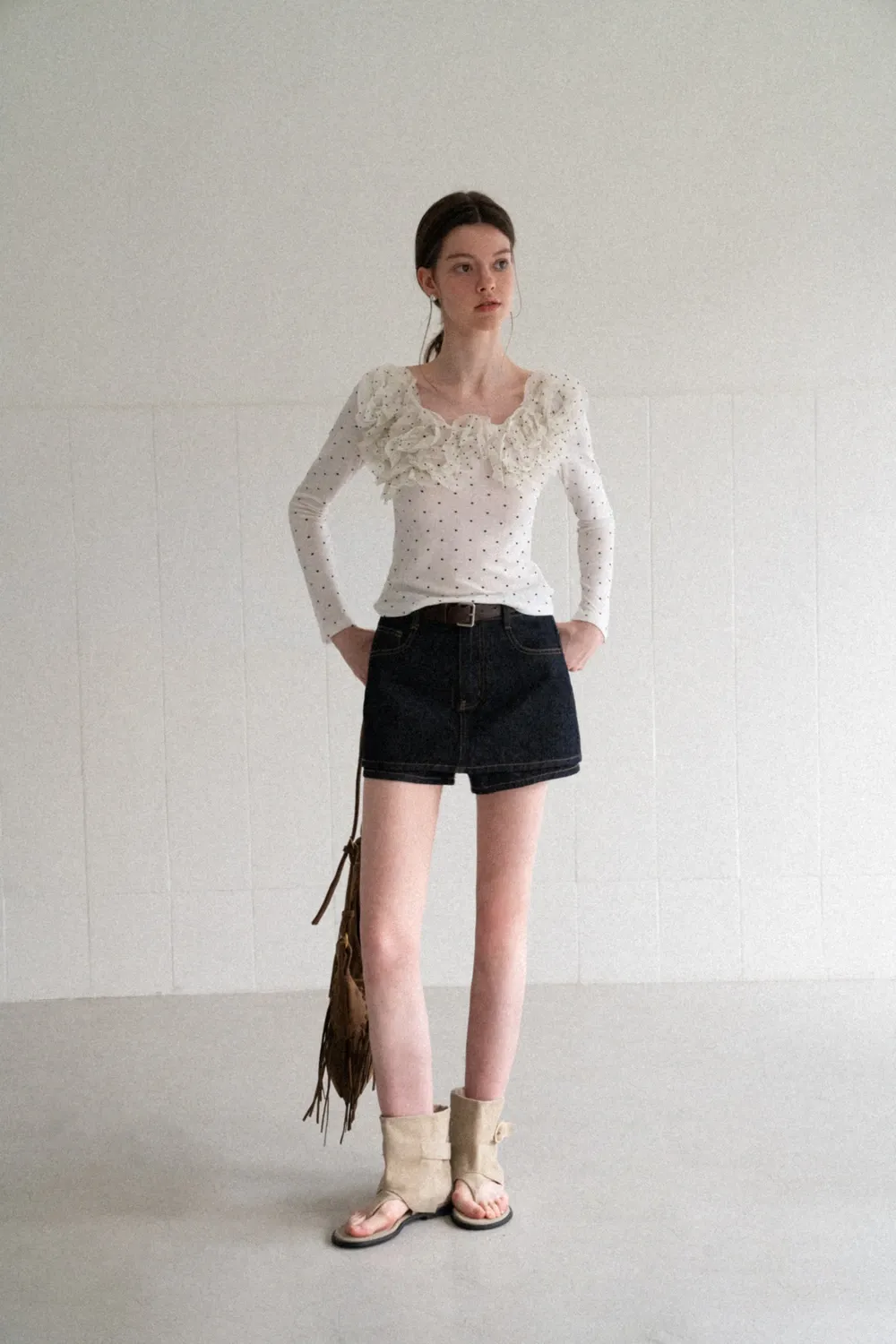 Polka dot long sleeve top with ruffled neckline