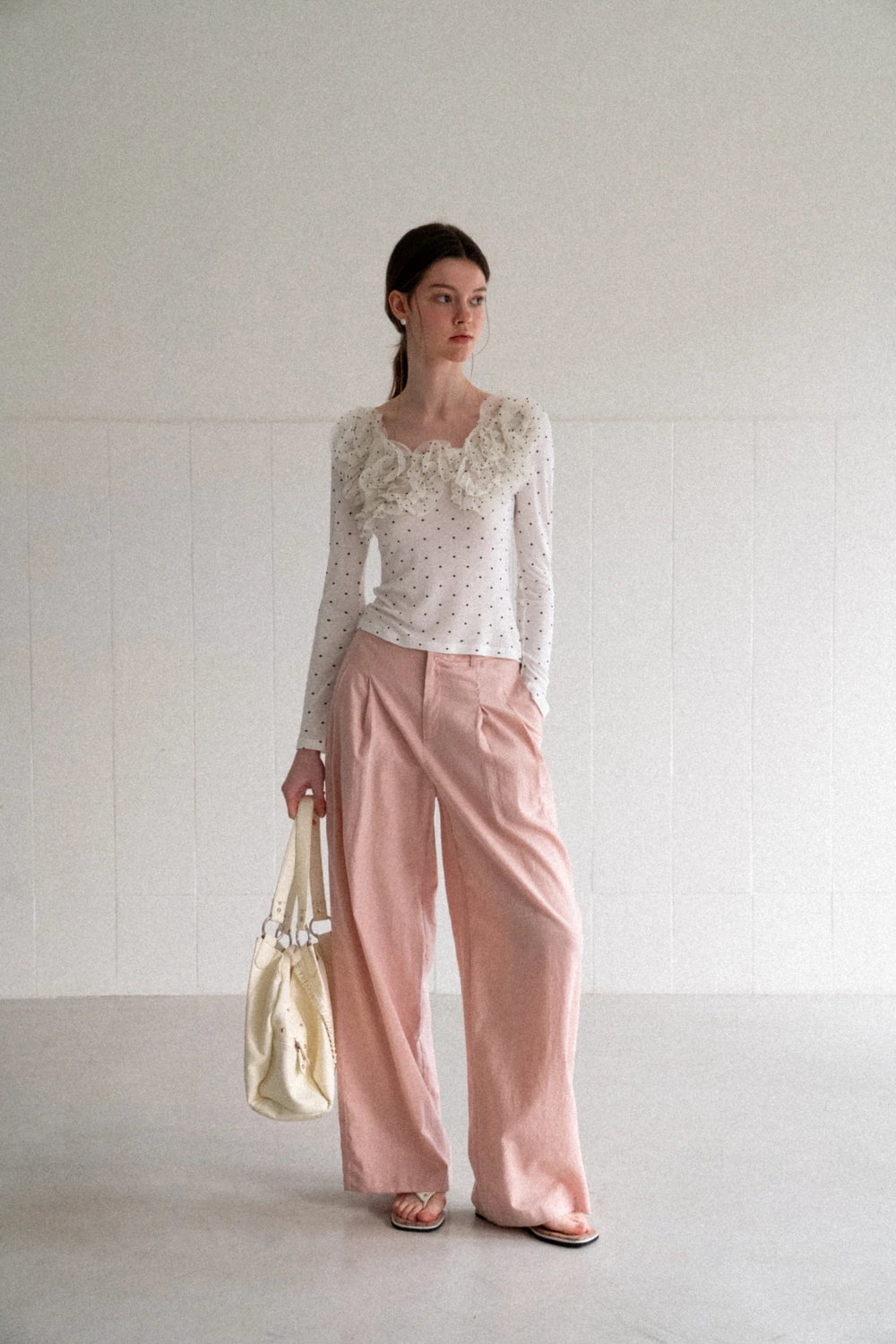 Polka dot long sleeve top with ruffled neckline