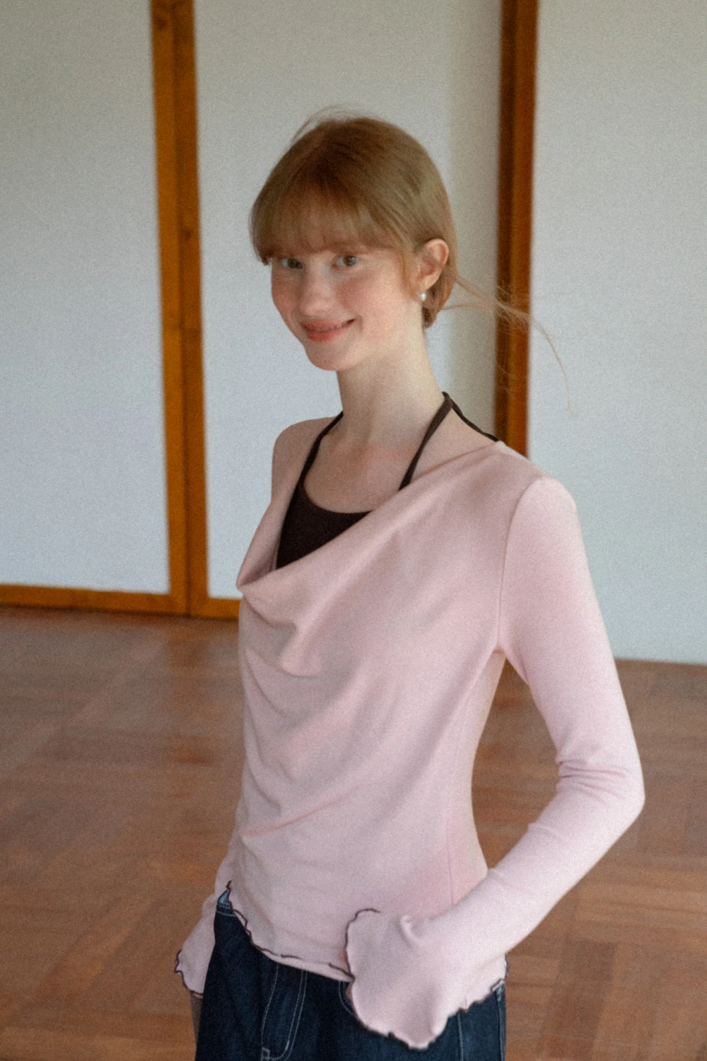 Beige Long-Sleeve Top with Ruffled Hem and Bow Tie Back