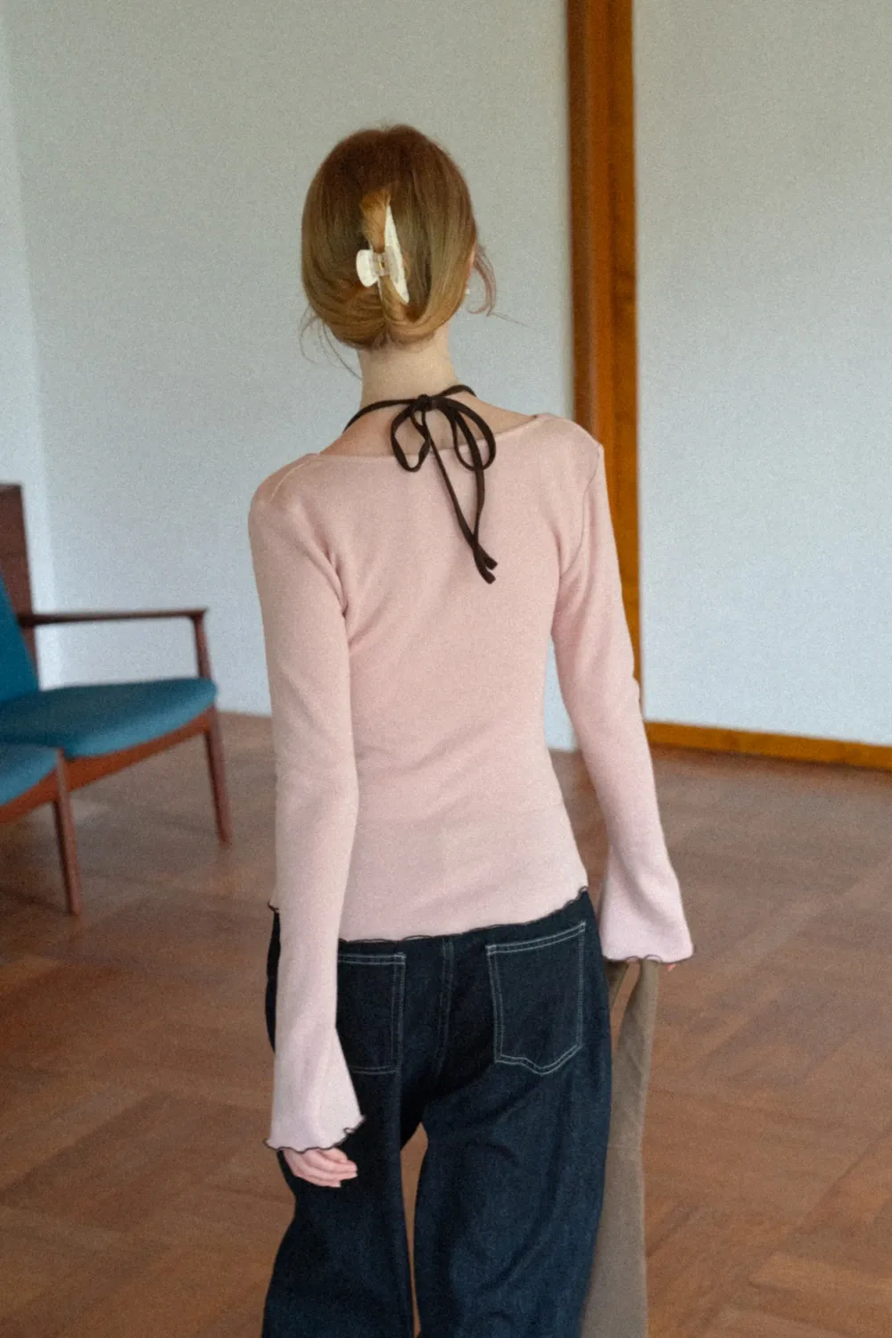 Beige Long-Sleeve Top with Ruffled Hem and Bow Tie Back