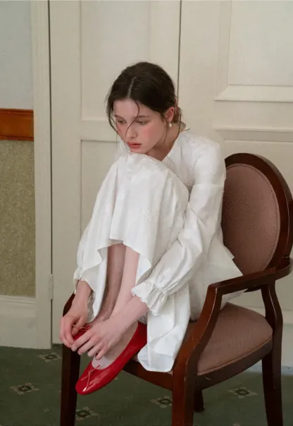 Shirt with ruffled sleeves and layered skirt