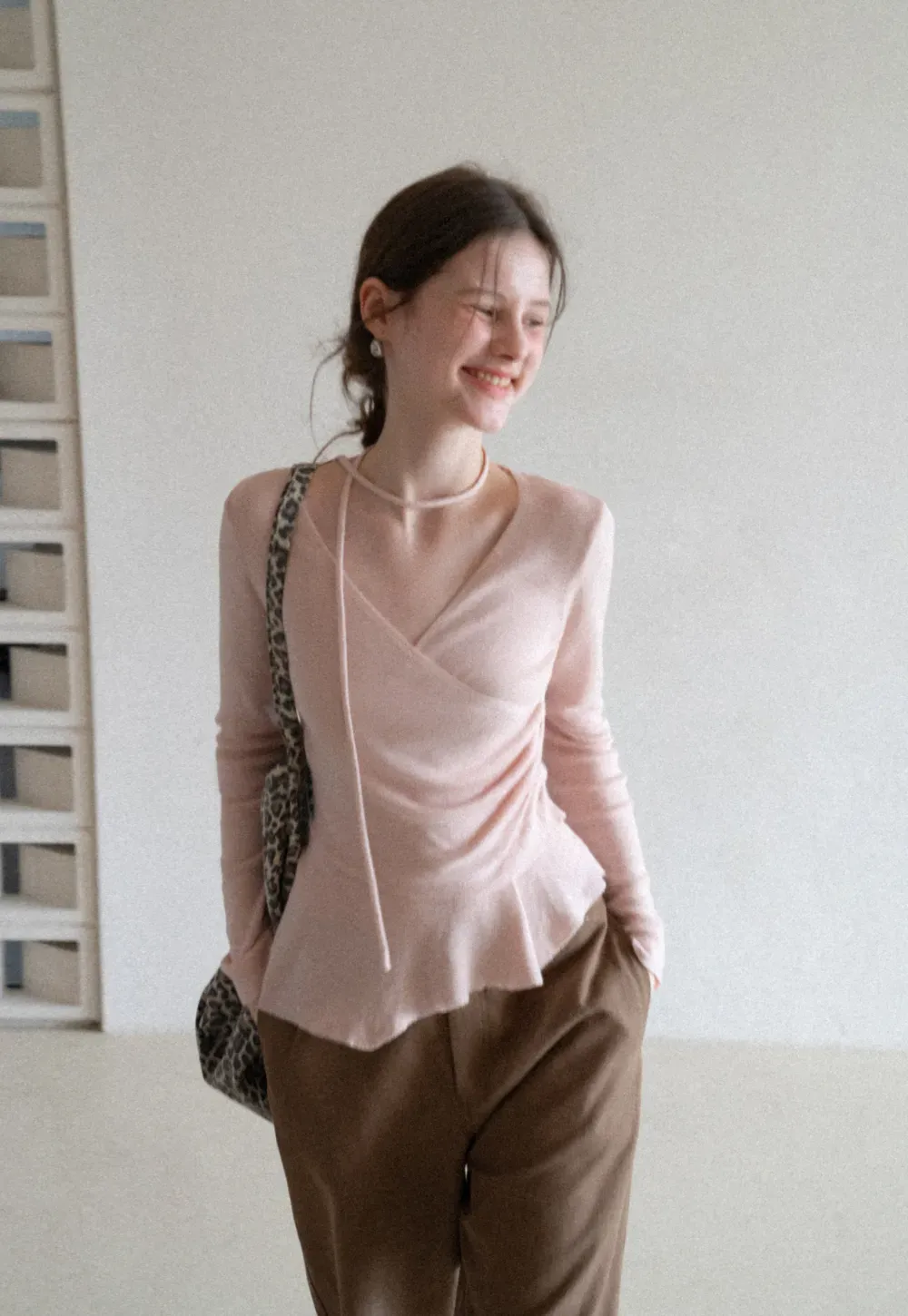 Long sleeve wrap knit sweater with ruched detail