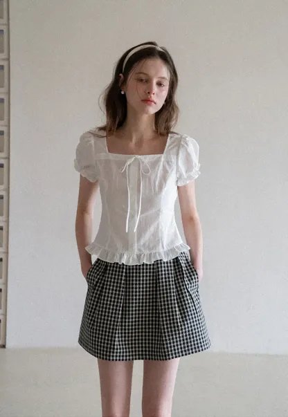 Plaid skirt with pleats and ruffled top