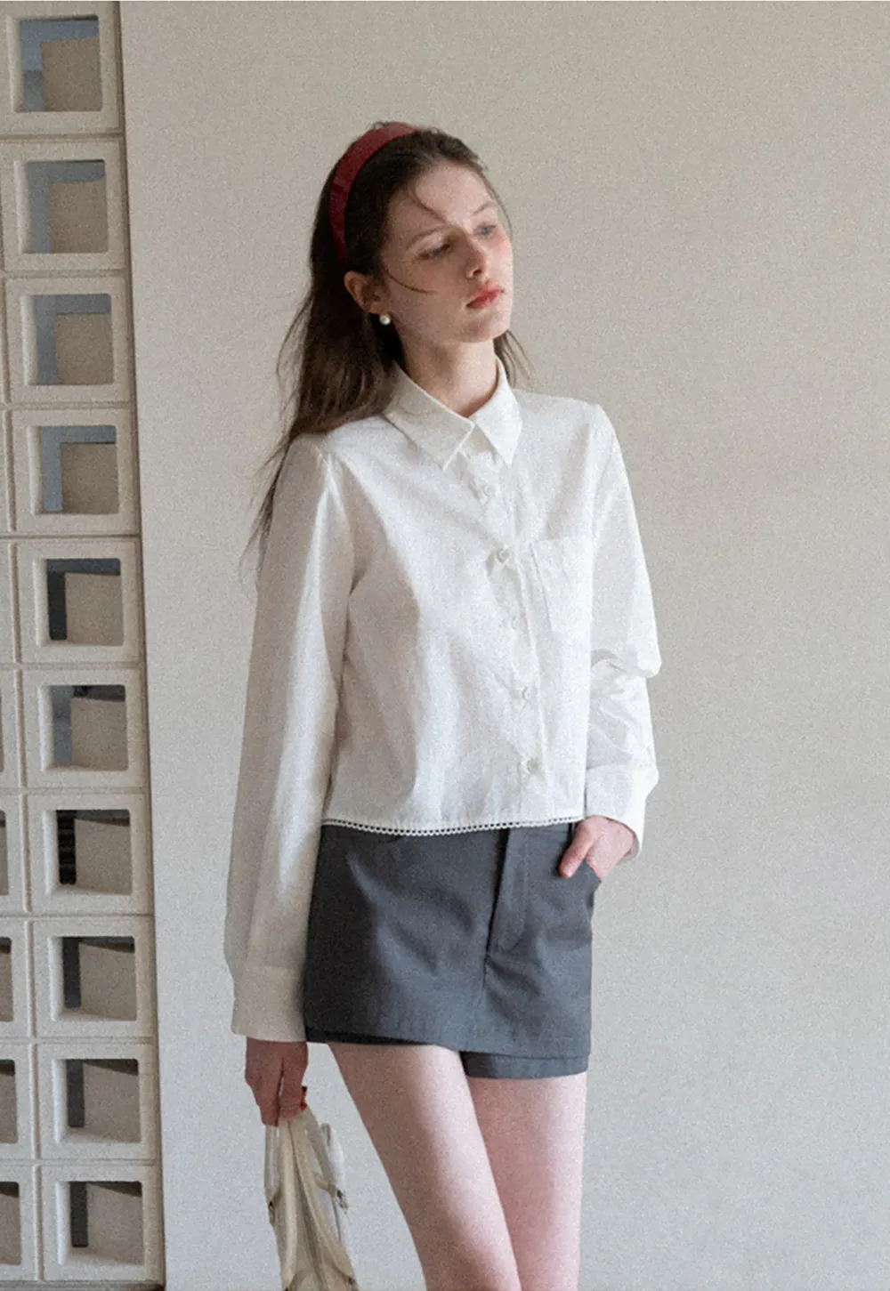 Long sleeve button front shirt with scalloped hem
