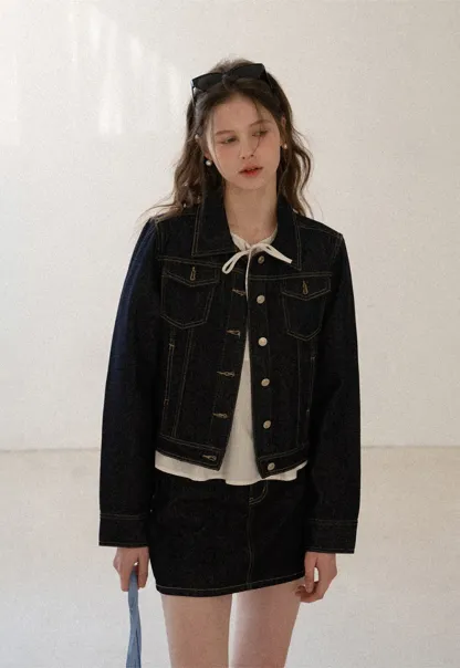 A-line denim skirt with front pocket design and adjustable waistband.