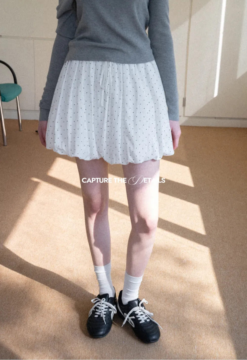 Polka dot pleated mini skirt with drawstring waist