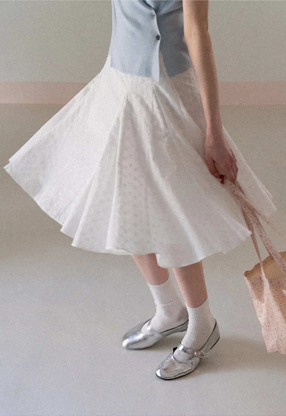 Flared pleated skirt with subtle texture