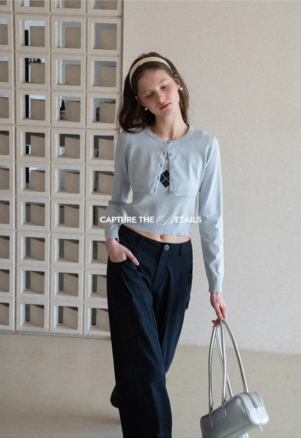 Woolen knit sweater with argyle pattern and buttons