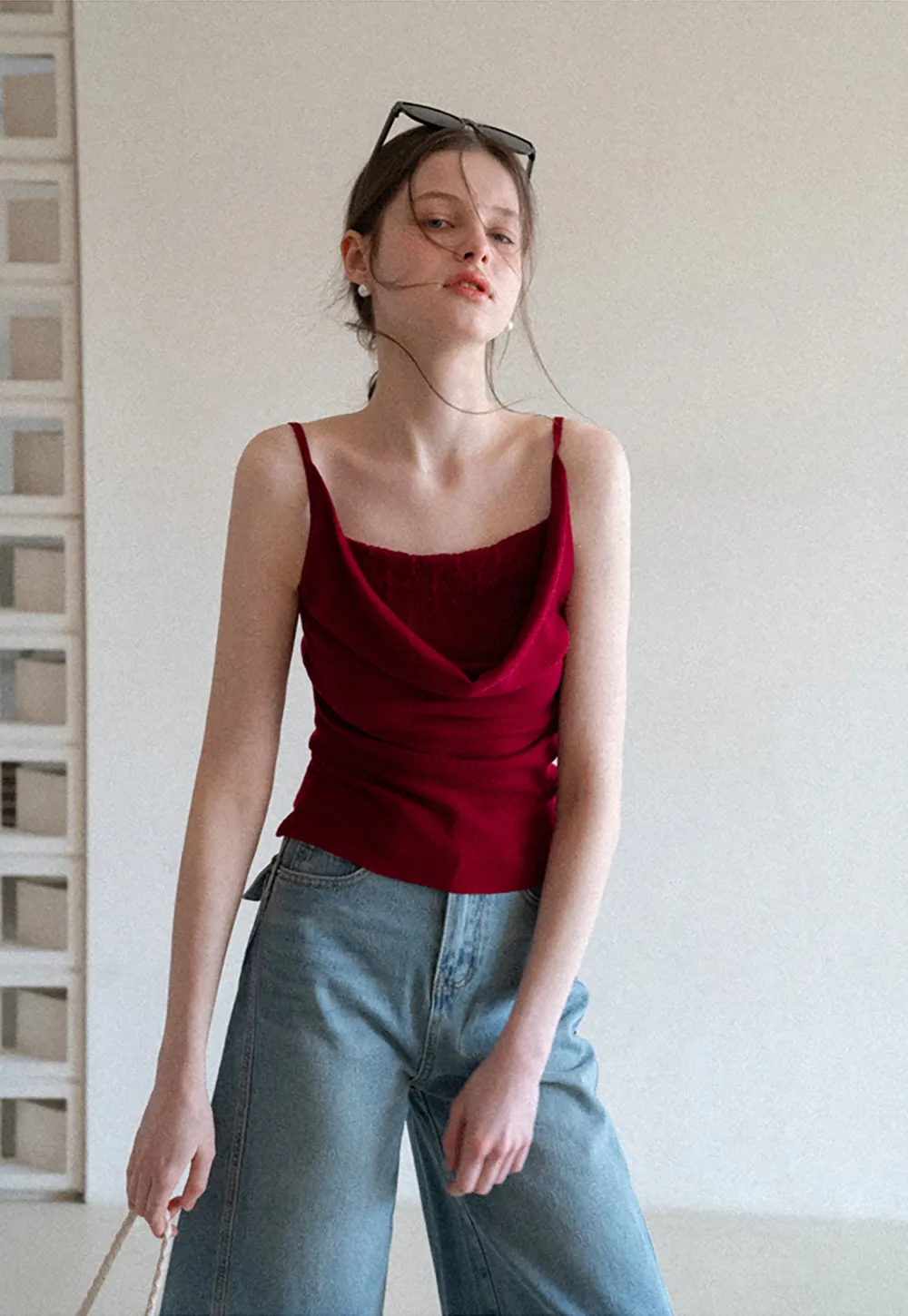 Silk-like tank top with thin straps and draped neckline
