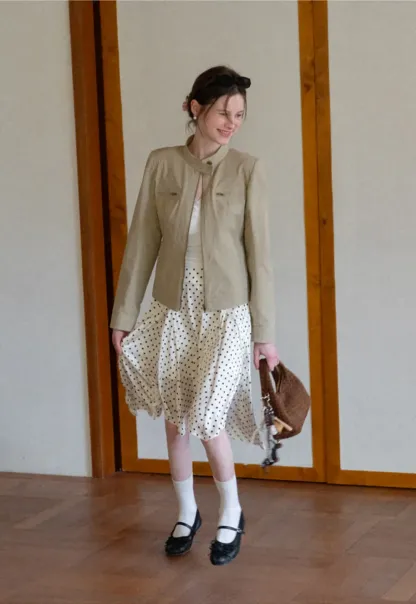 Polka dot asymmetrical hem skirt with pleats