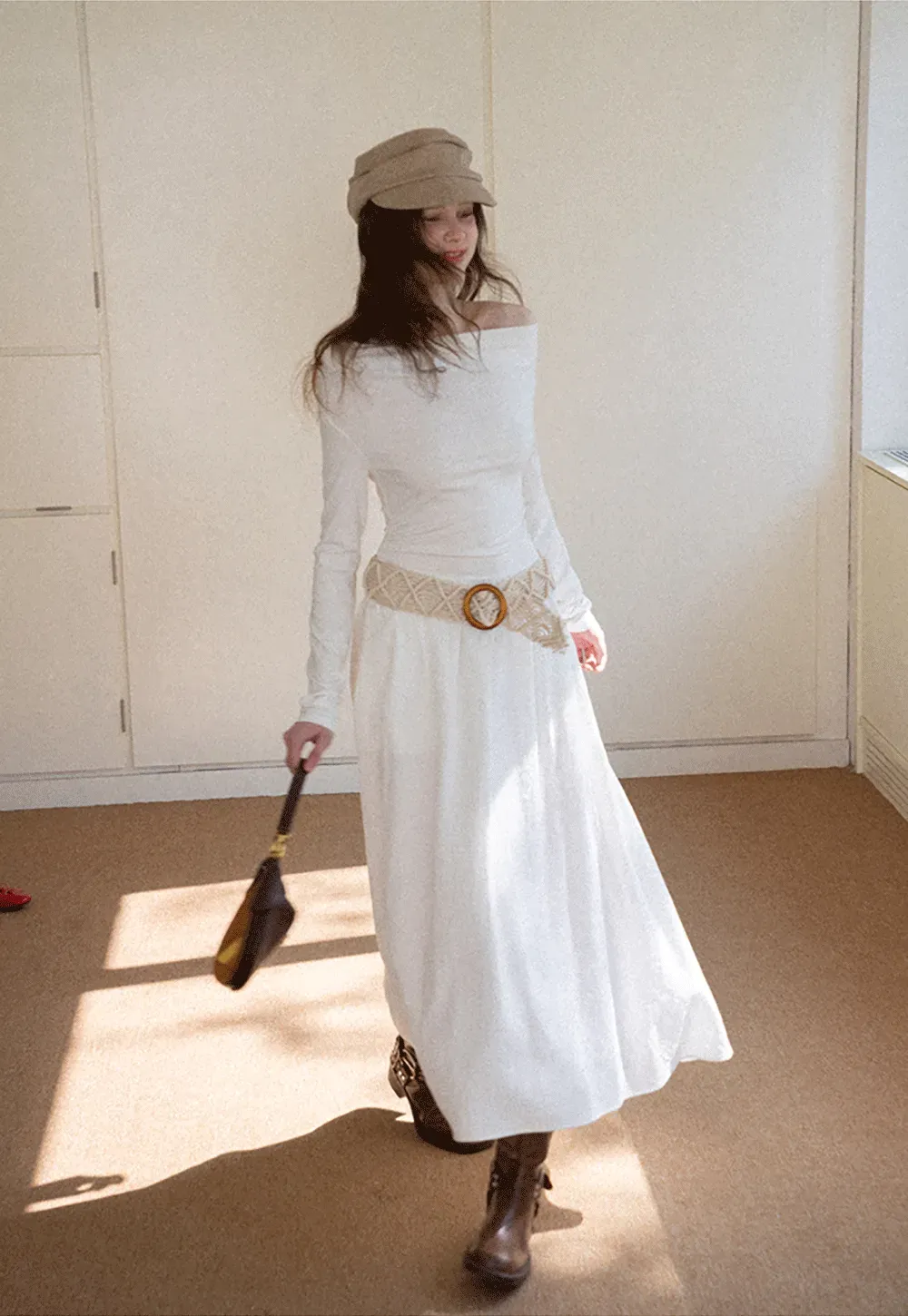 Elegant asymmetrical long sleeve dress with unique belt design