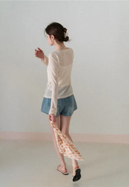 Long sleeve sheer knit top with round neckline