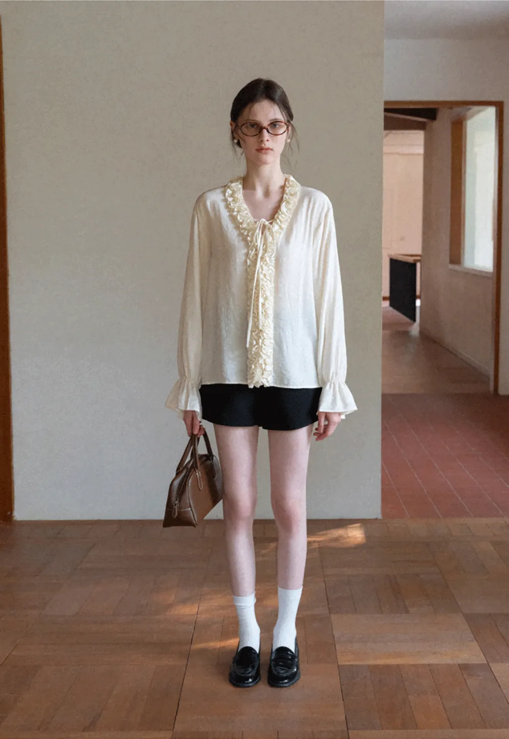 Long sleeve shirt with ruffled neckline and gathered cuffs