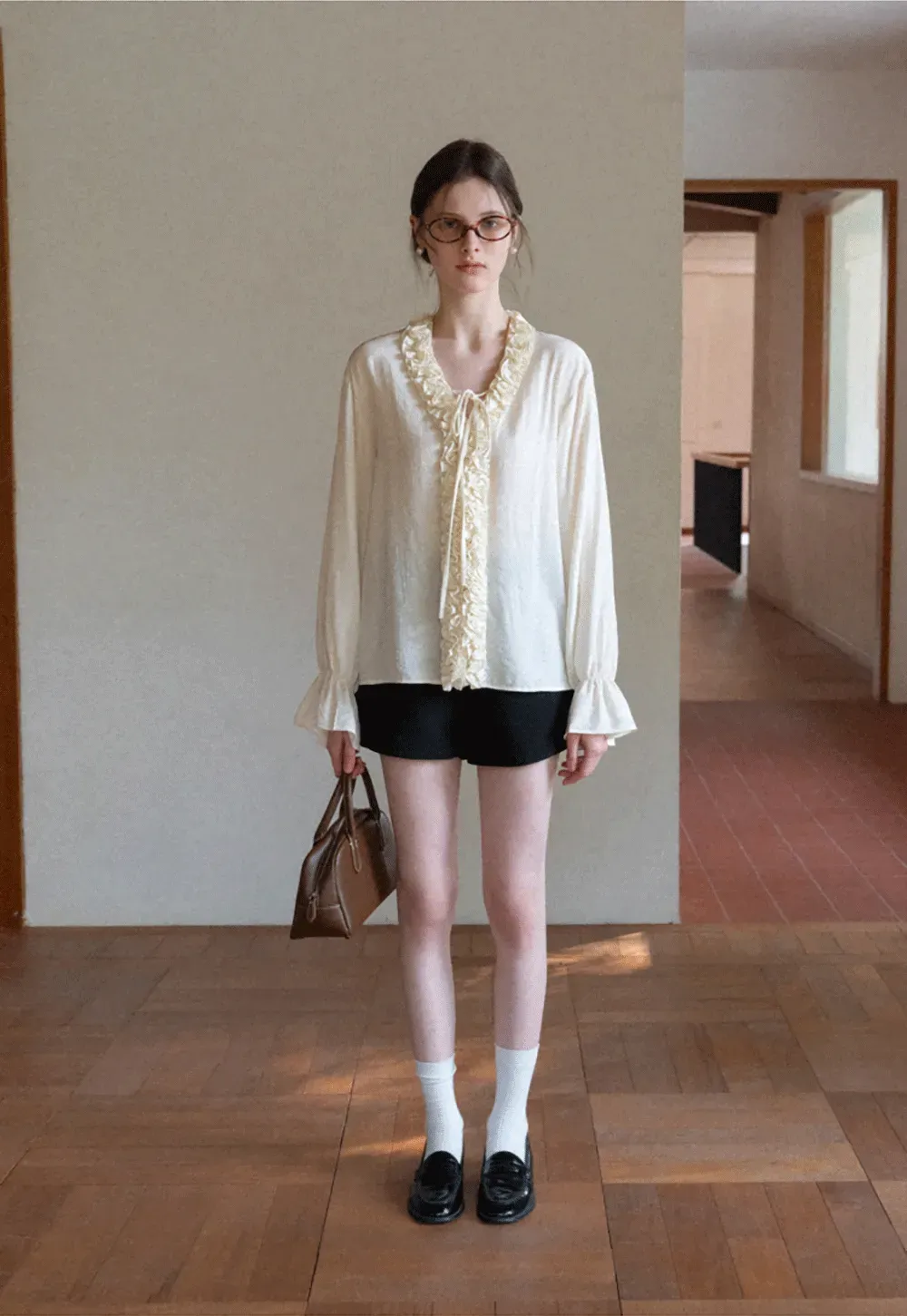 Long sleeve shirt with ruffled neckline and gathered cuffs