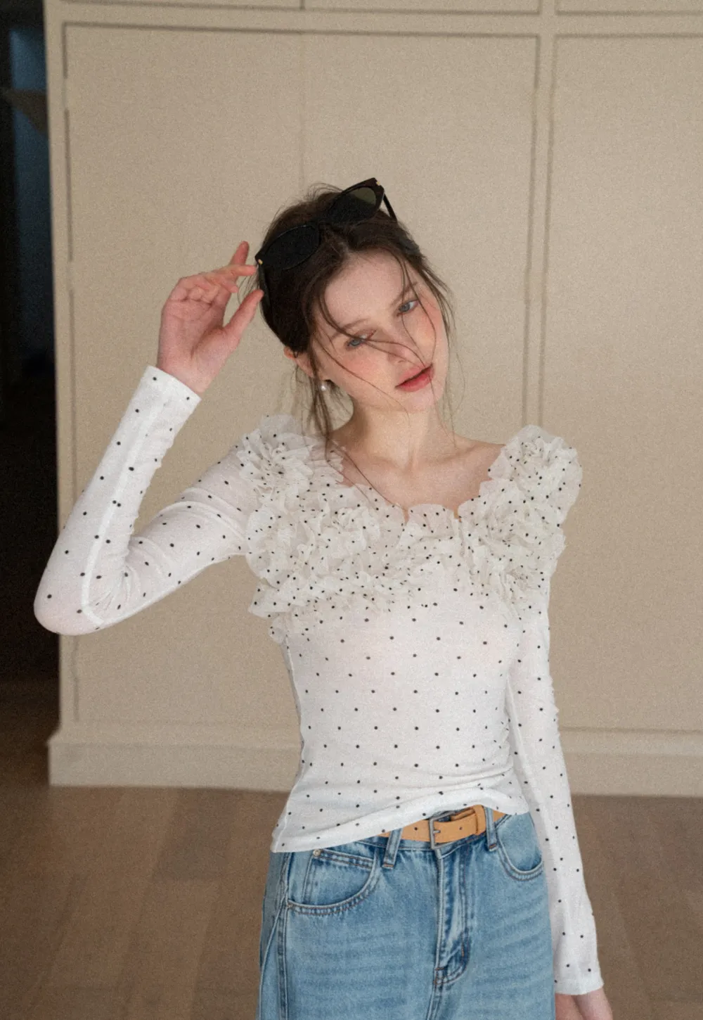 Polka dot long sleeve top with ruffled neckline