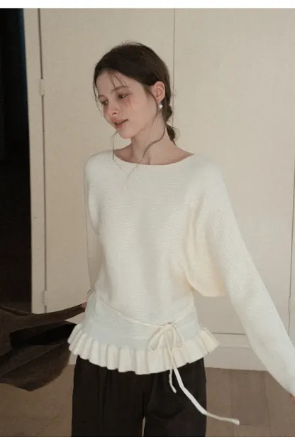 Ribbed knit sweater with tie back and flared hem design