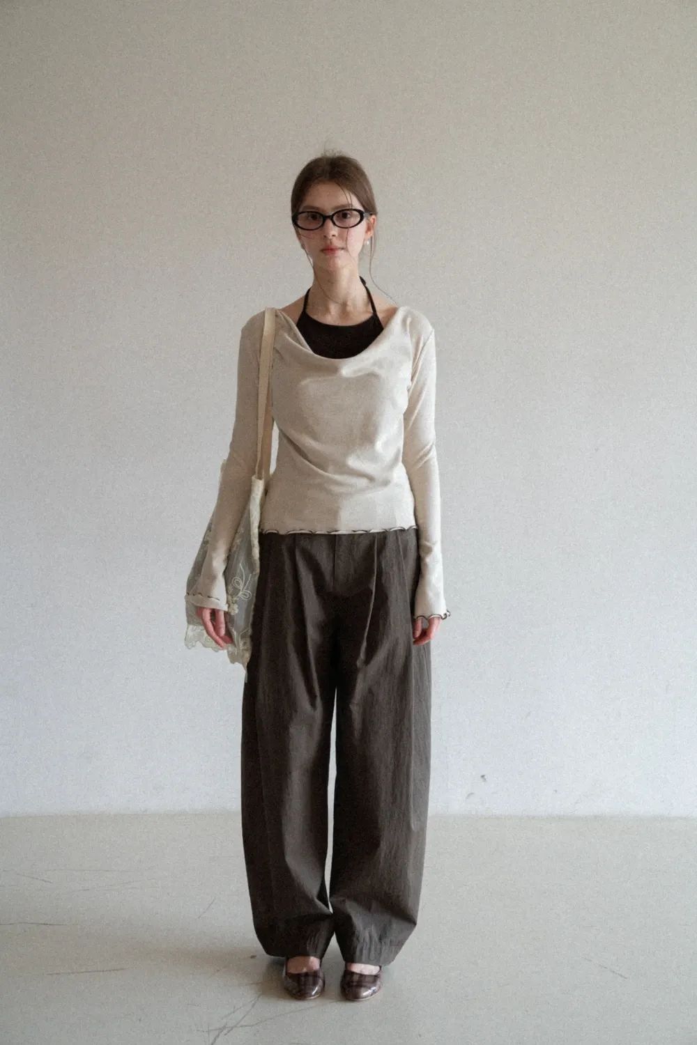 Beige Long-Sleeve Top with Ruffled Hem and Bow Tie Back