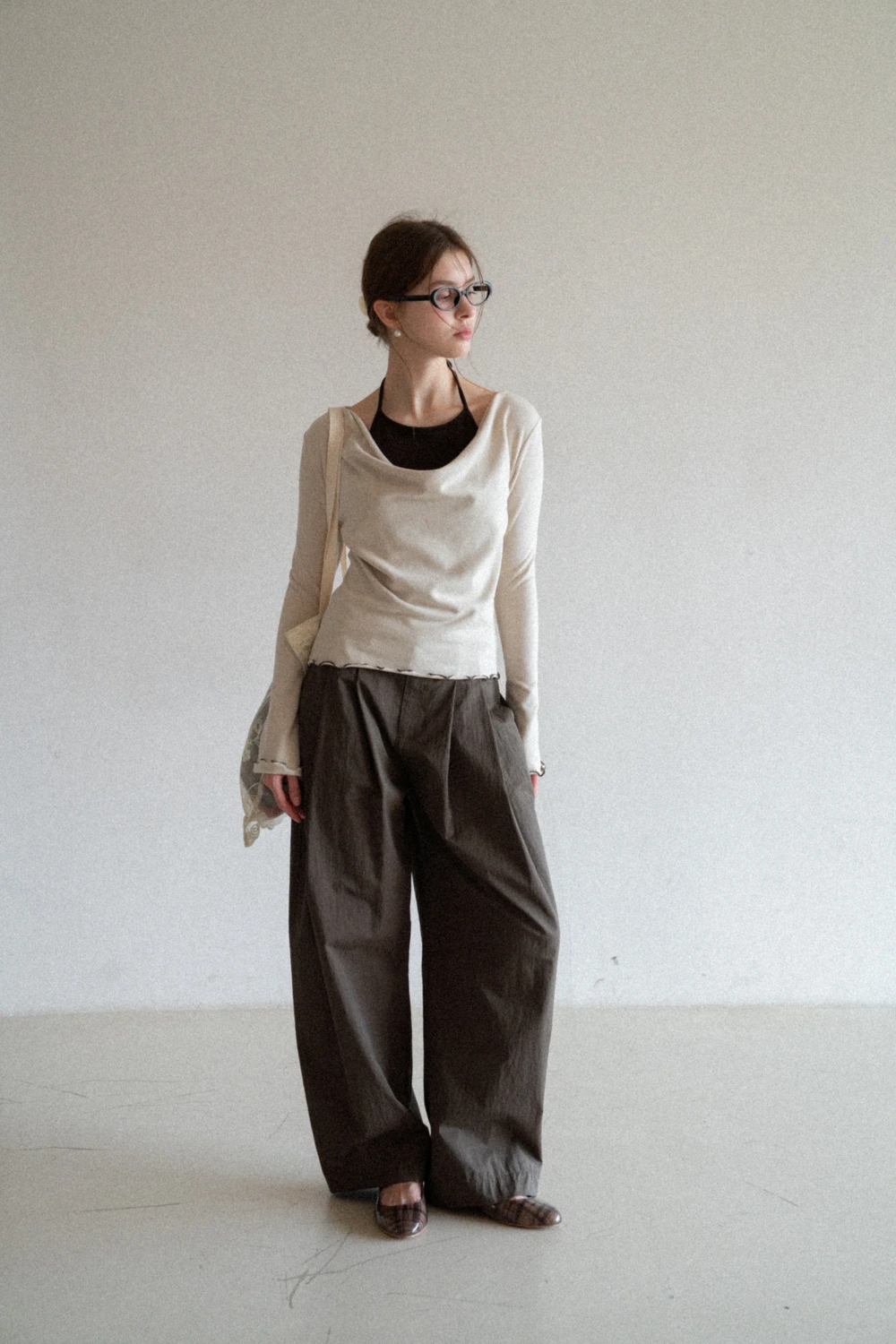 Beige Long-Sleeve Top with Ruffled Hem and Bow Tie Back