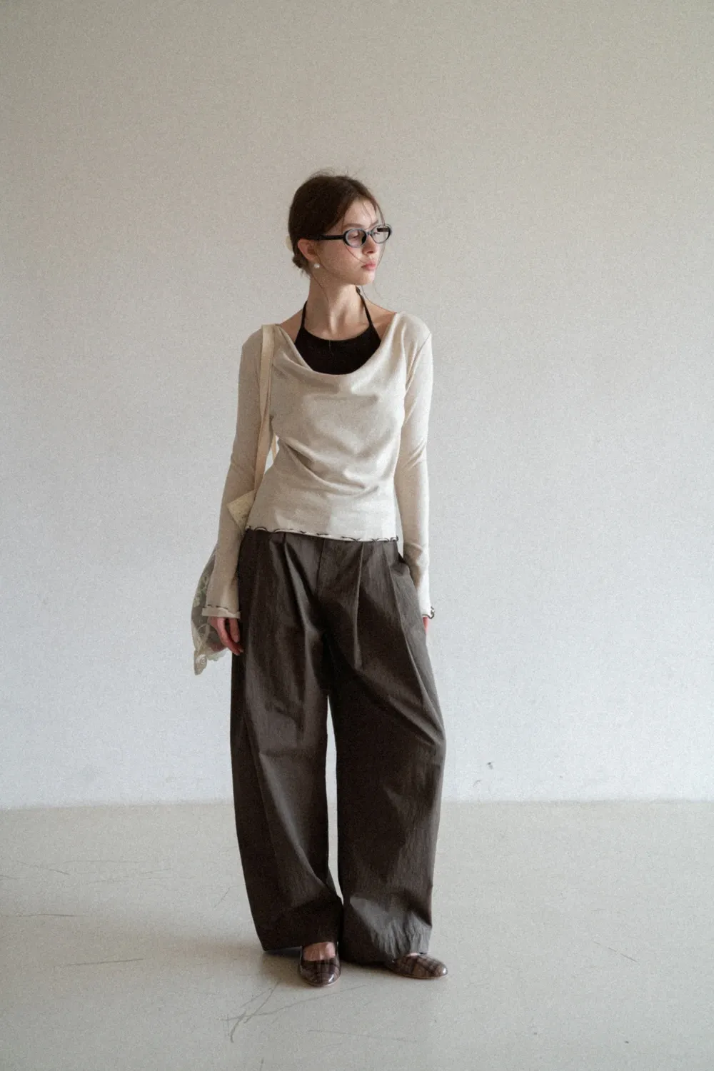 Beige Long-Sleeve Top with Ruffled Hem and Bow Tie Back