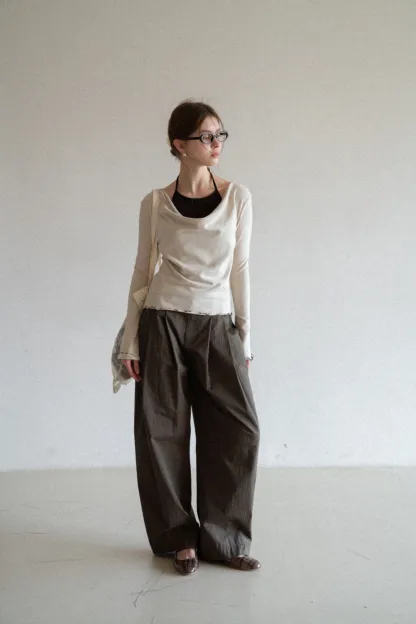 Beige Long-Sleeve Top with Ruffled Hem and Bow Tie Back