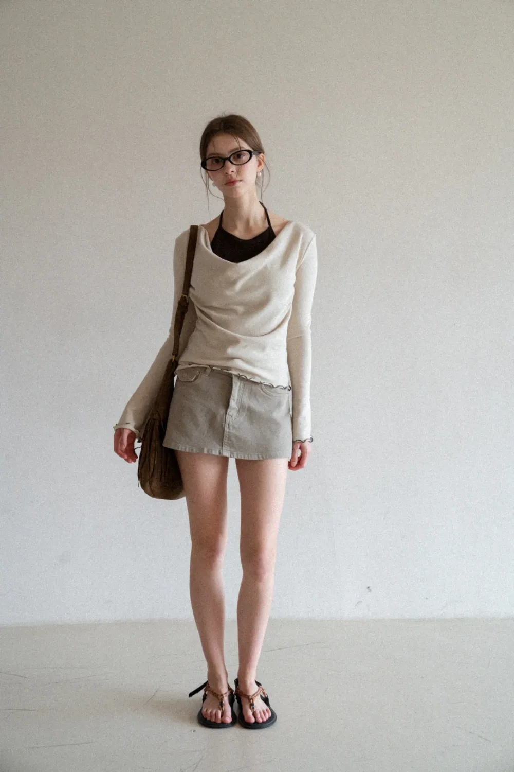 Beige Long-Sleeve Top with Ruffled Hem and Bow Tie Back