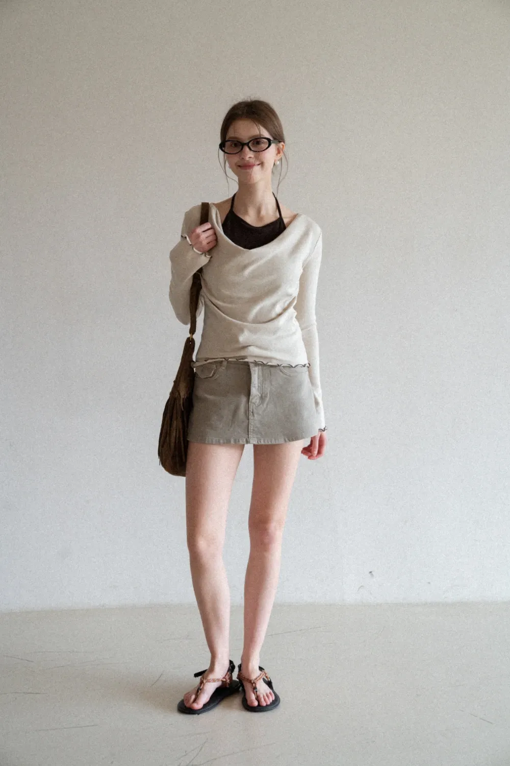 Beige Long-Sleeve Top with Ruffled Hem and Bow Tie Back