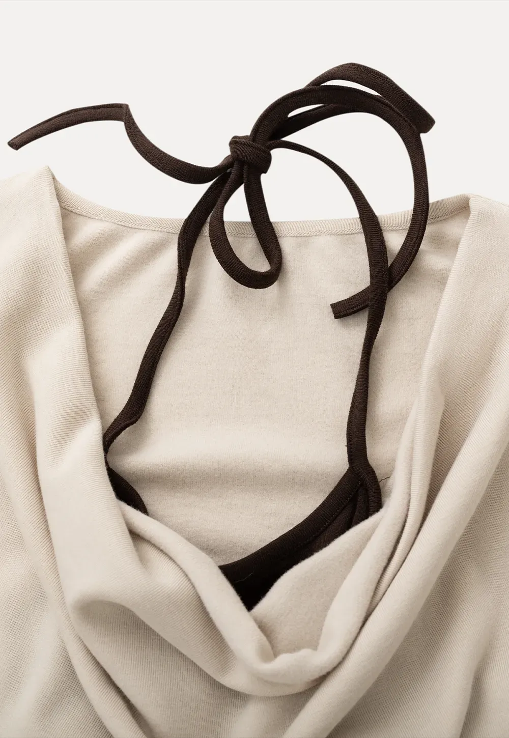 Beige Long-Sleeve Top with Ruffled Hem and Bow Tie Back