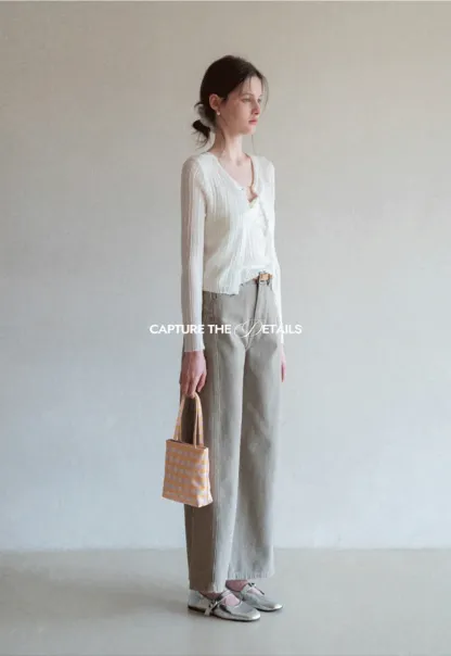 Ribbed knit sweater with V neckline and long sleeves