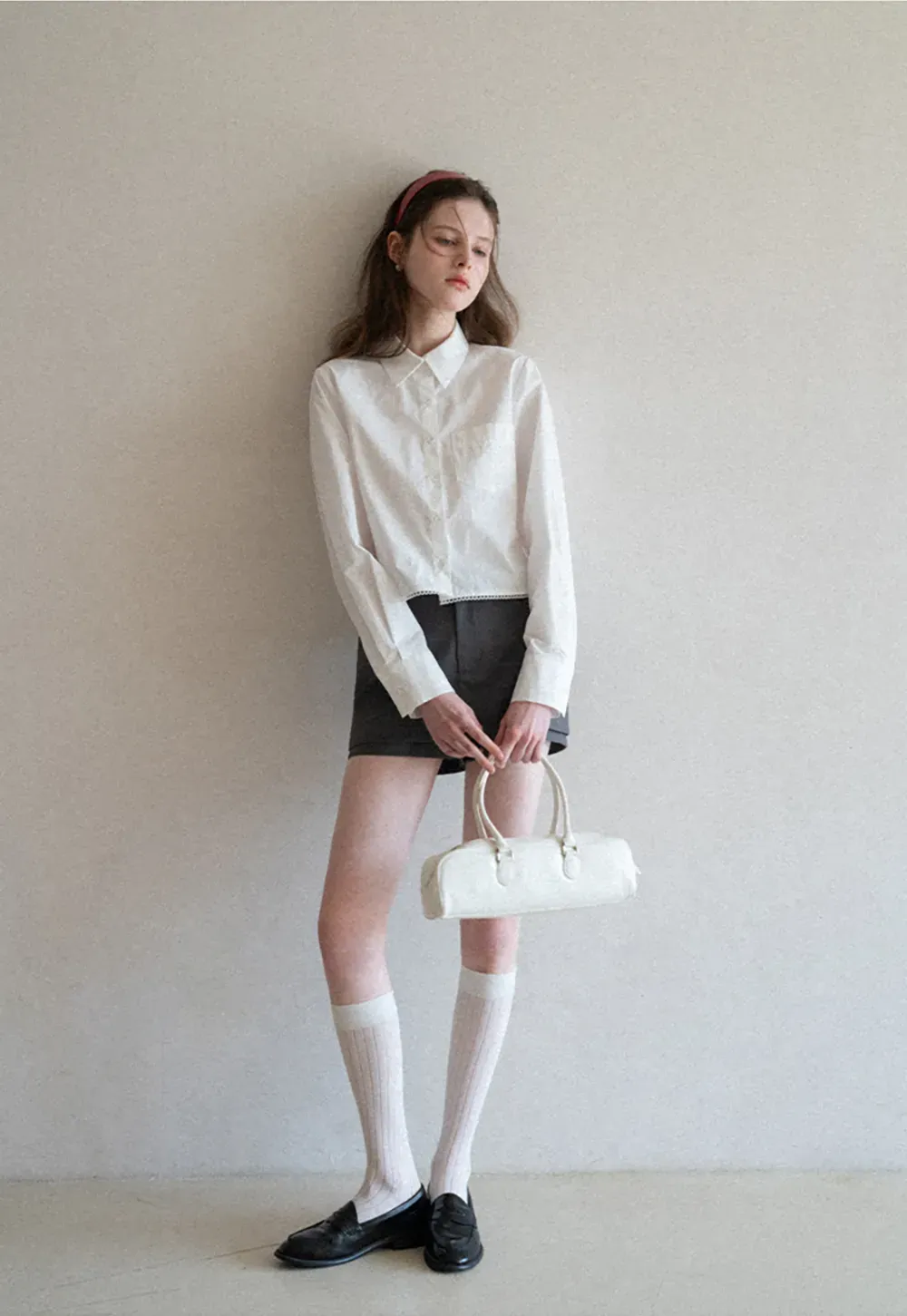 Long sleeve button front shirt with scalloped hem