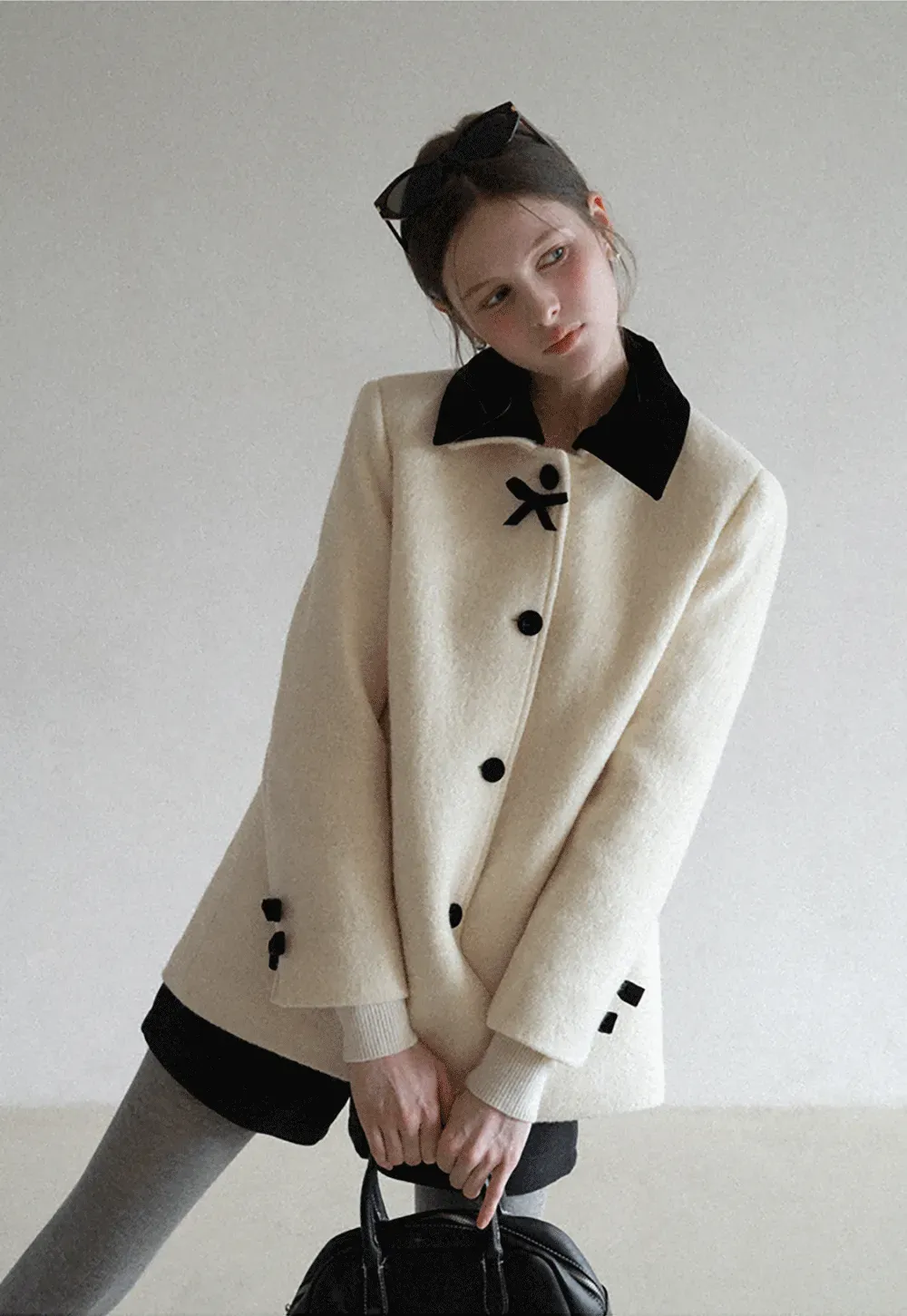 Elegant Wool Coat with Bow Detail and Contrasting Collar