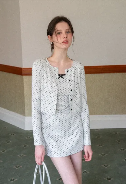 Polka dot dress with lace trim and matching cardigan