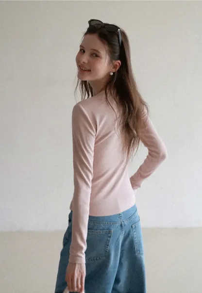Long sleeve top with ruffled hem and layered design