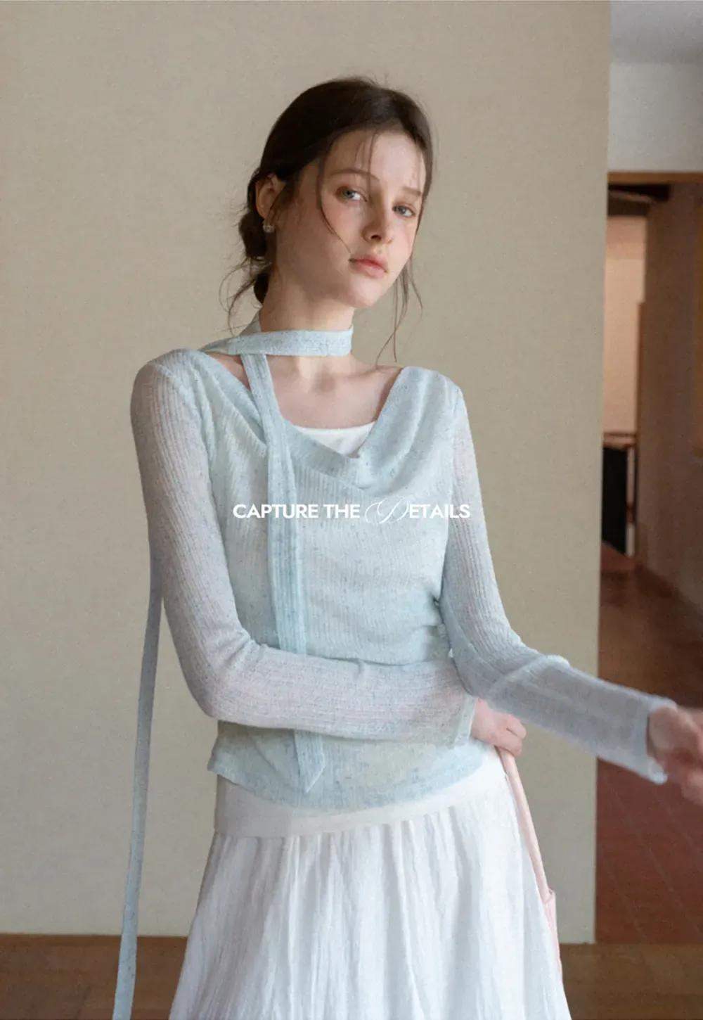 Long sleeve knit top with back tie detail