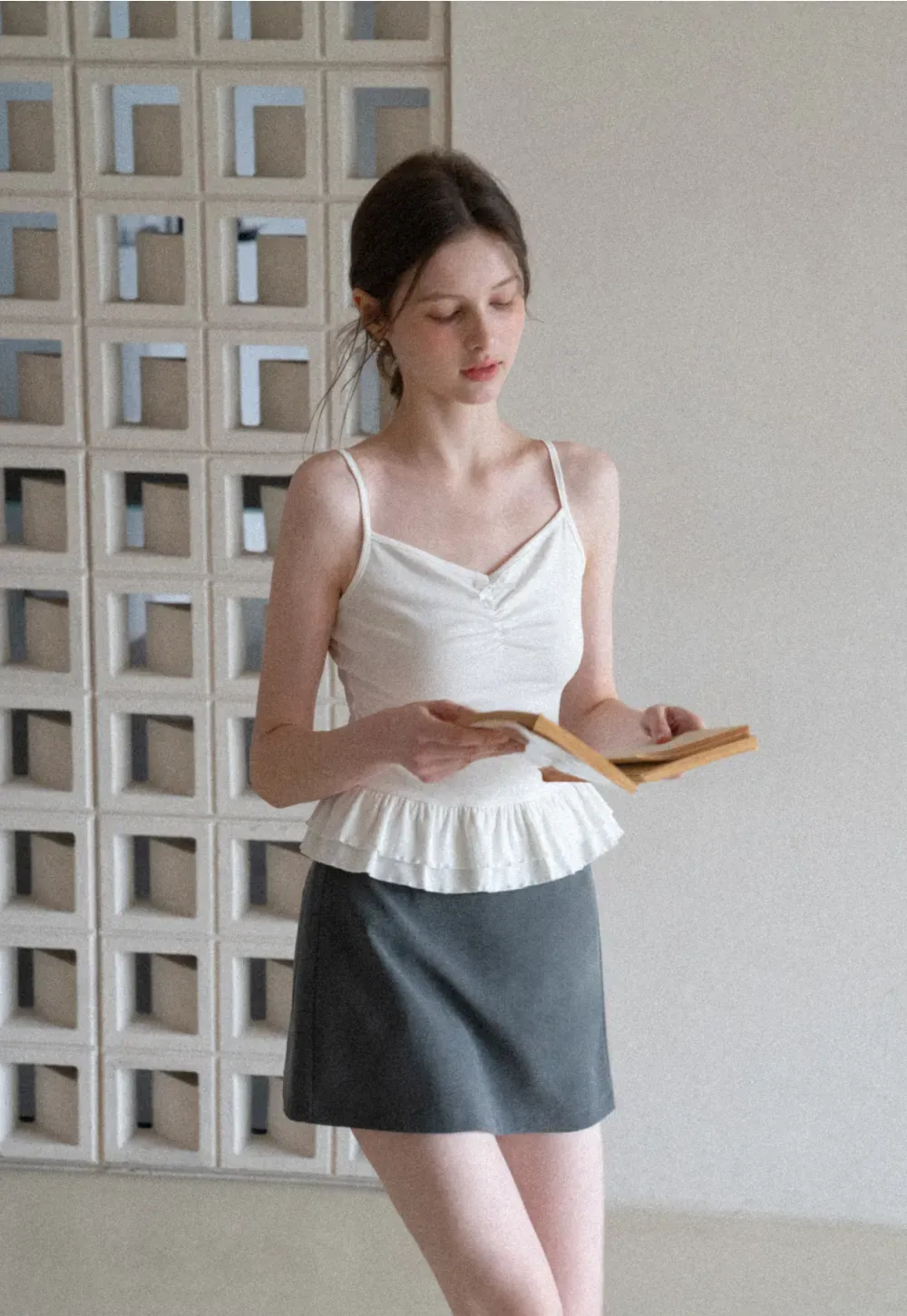 Elegant Pleated Mini Skirt with Asymmetrical Hem