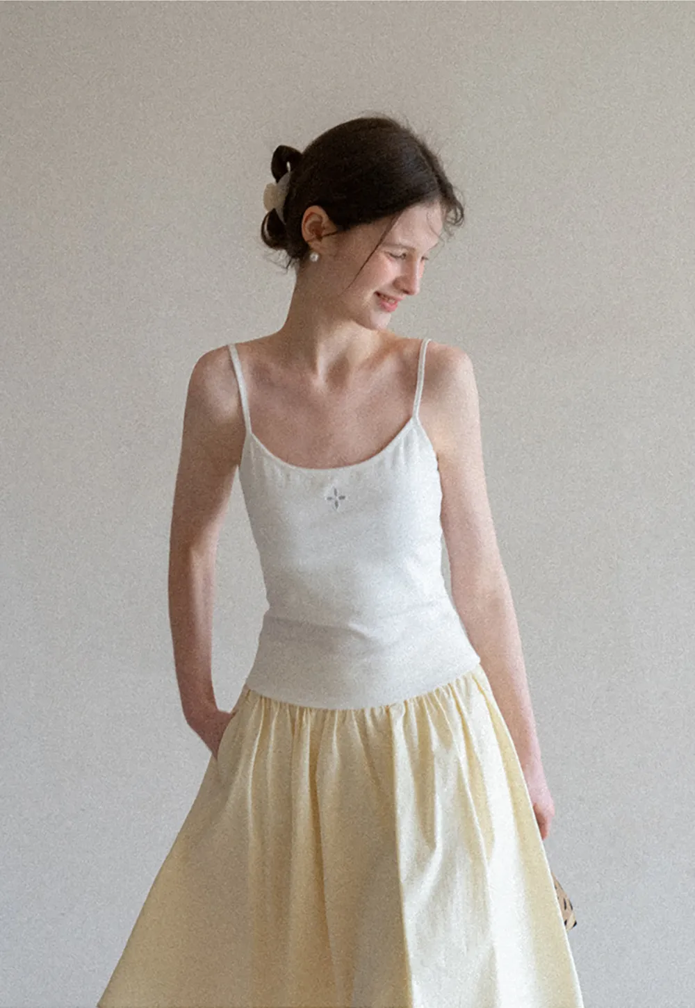 Gray tank top with small embroidered cross detail