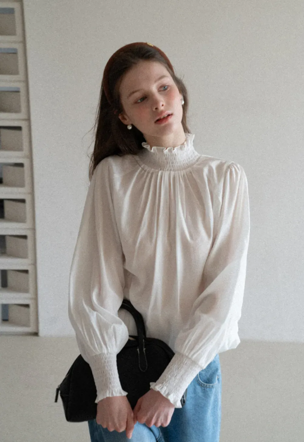 Elegant High Neck Blouse with Ruffled Cuffs and Hem