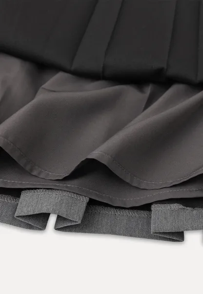 Pleated skirt with front bow detail