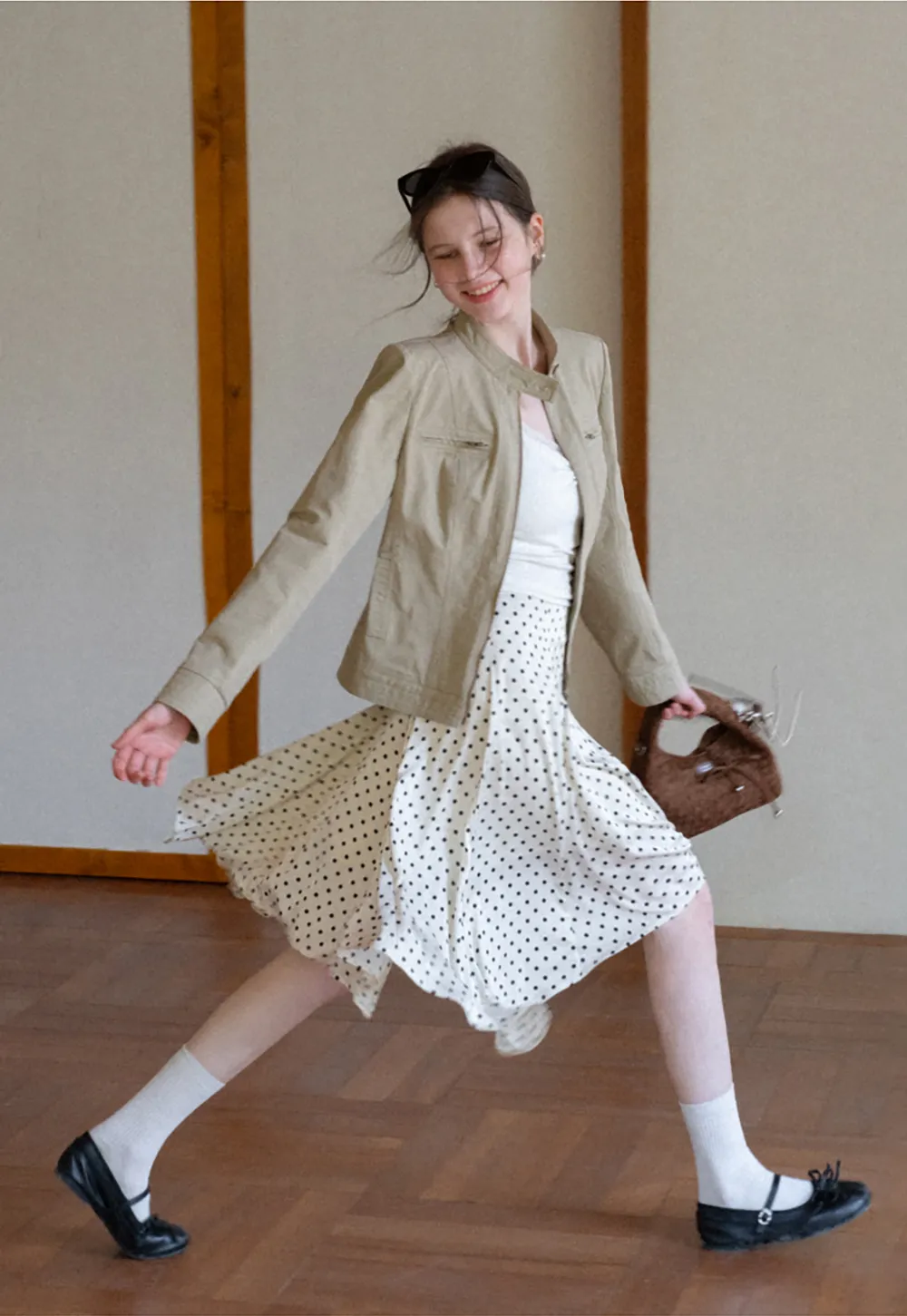 Polka dot asymmetrical hem skirt with pleats