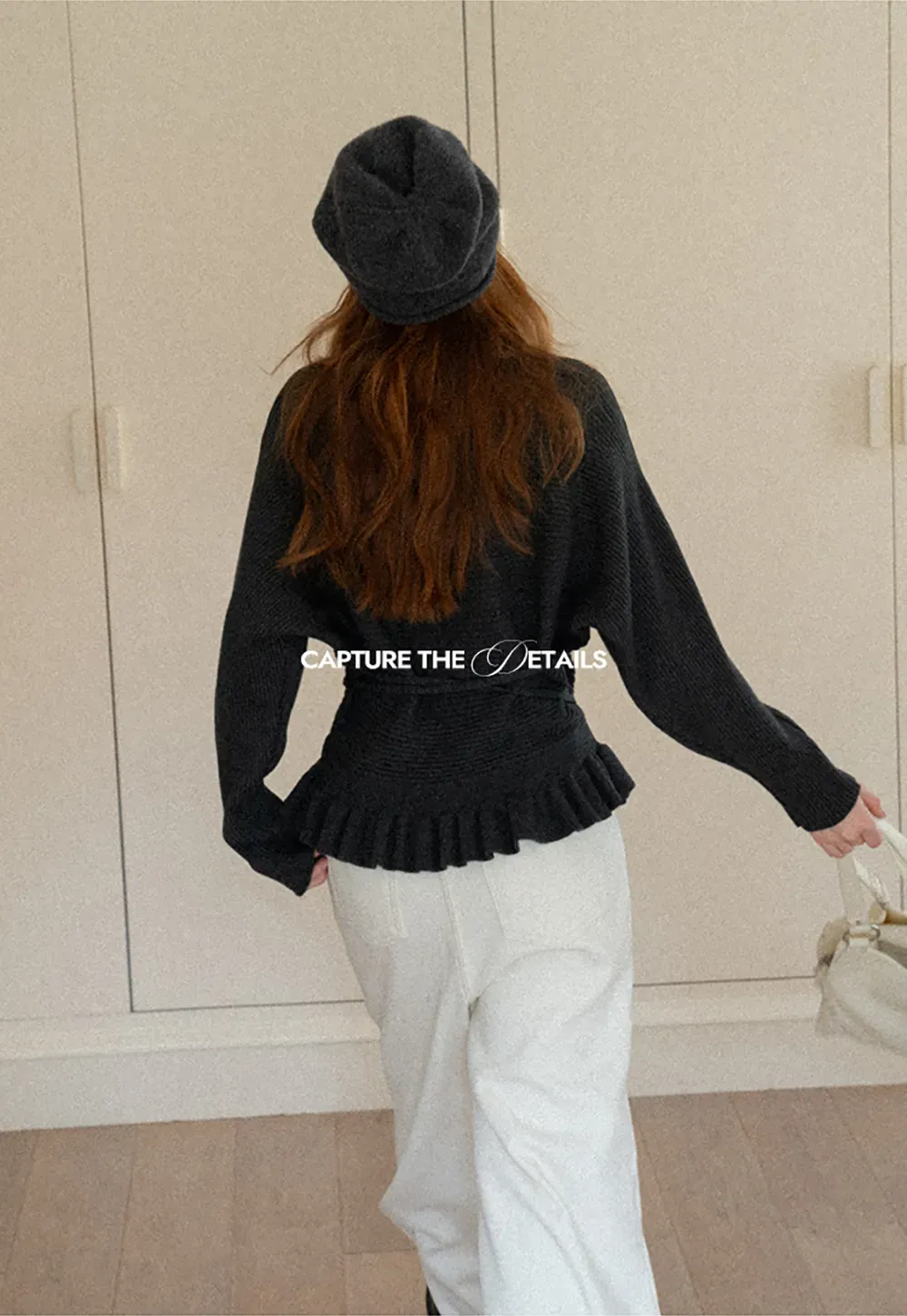 Ribbed knit sweater with tie back and flared hem design