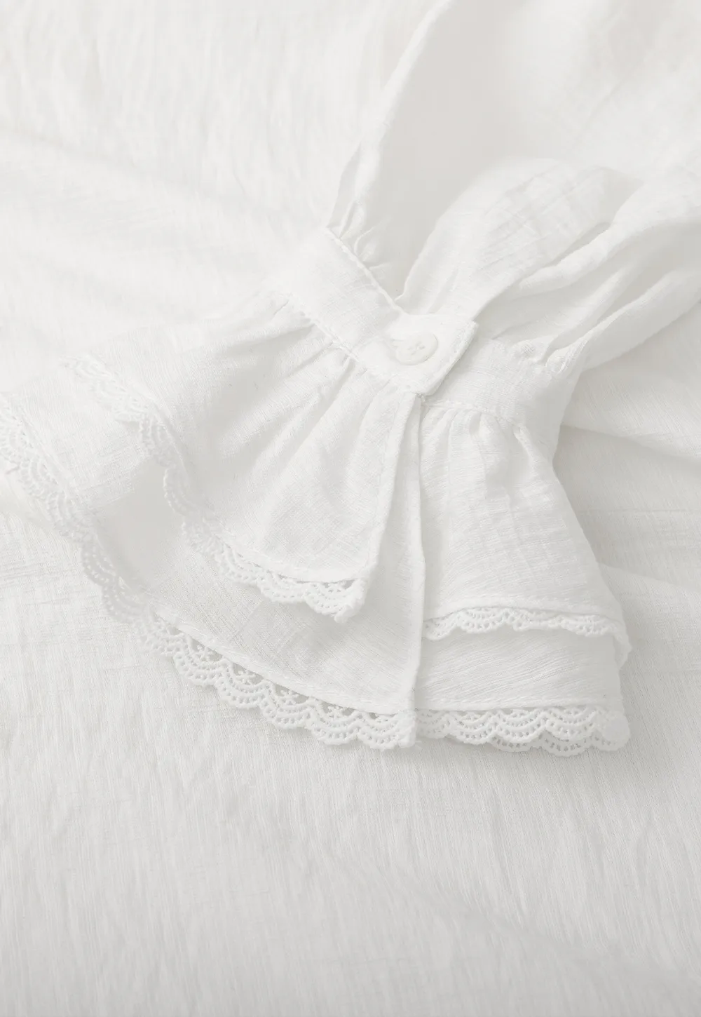 Elegant Blouse with Ruffled Neckline and Flared Sleeves